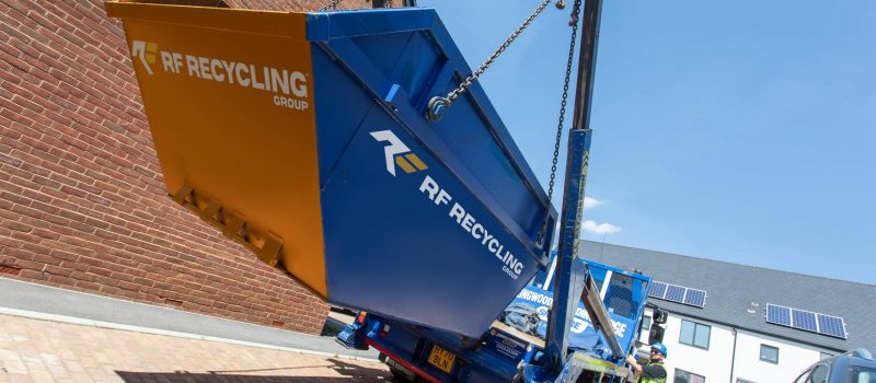 rf recycling lorry picking up a skip