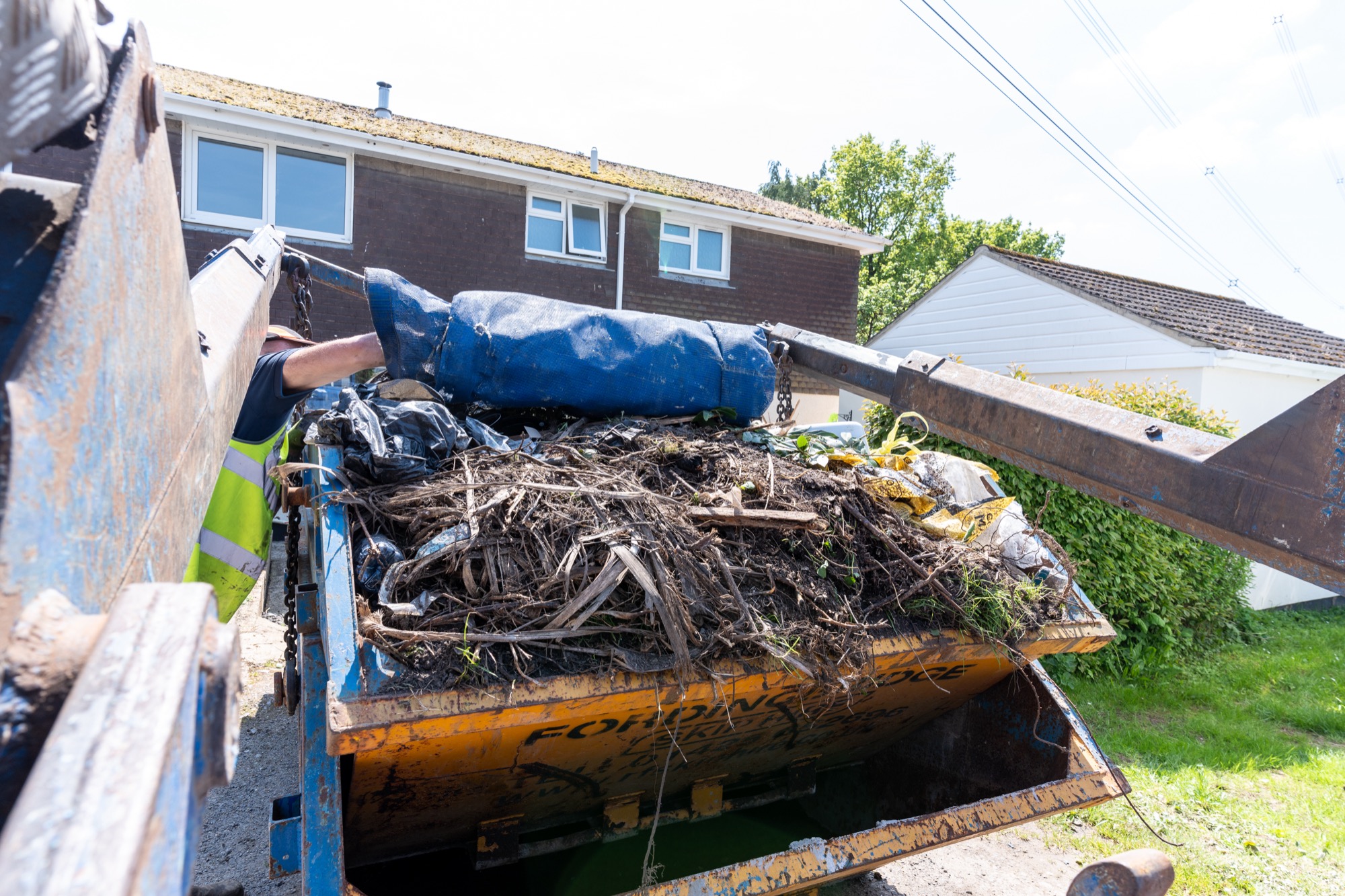 skip full of garden waste