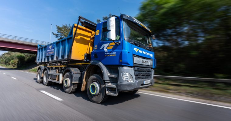 roll on roll off skip lorry on the road