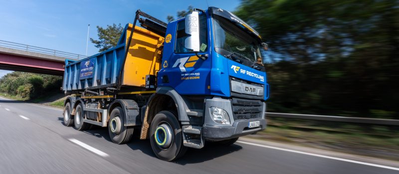 roll on roll off skip lorry on the road