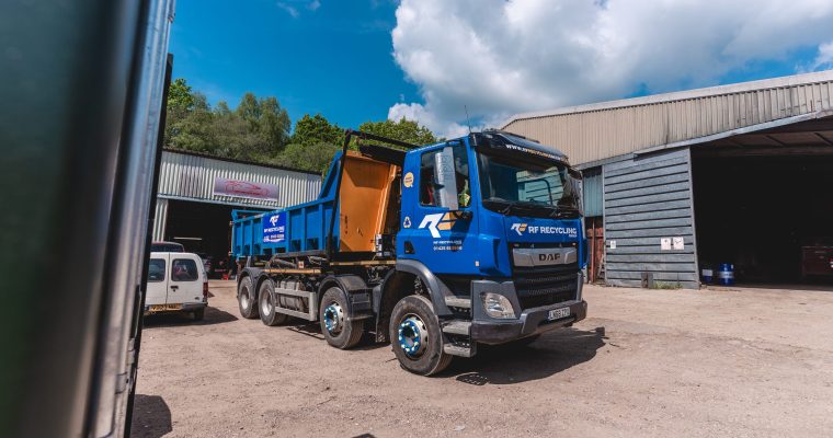 a roll on roll off skip on back of truck