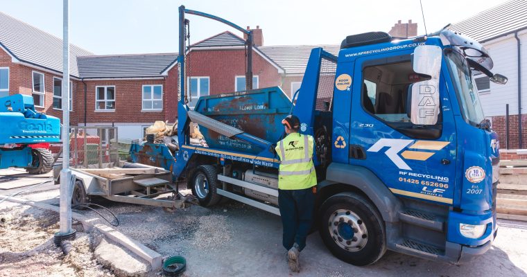 man working and delivering a skip