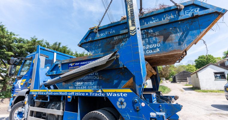 chain lift skip carrying green waste
